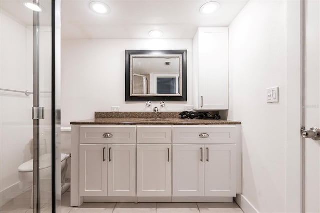 1150 Tarpon Center Dr Unit 1D, Venice, FL 34285 - bathroom featuring vanity, a stall shower, tile patterned floors, and recessed lighting
