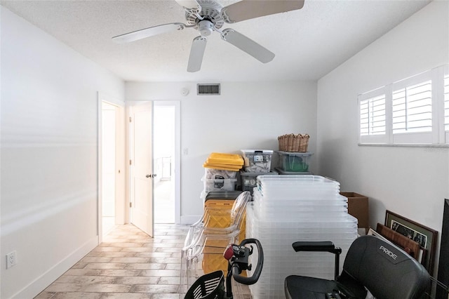 1150 Tarpon Center Dr Unit 1D, Venice, FL 34285 - bedroom with wood finished floors and a ceiling fan