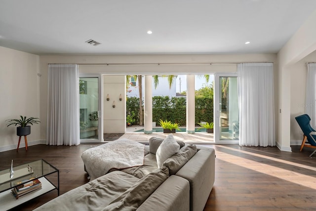 2711 W Trilby Ave, Tampa, FL 33611 - living room with wood finished floors and recessed lighting