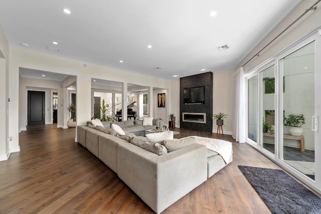 2711 W Trilby Ave, Tampa, FL 33611 - living area featuring recessed lighting, wood finished floors, and a large fireplace