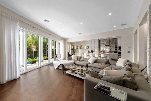 2711 W Trilby Ave, Tampa, FL 33611 - living room featuring wood finished floors and recessed lighting