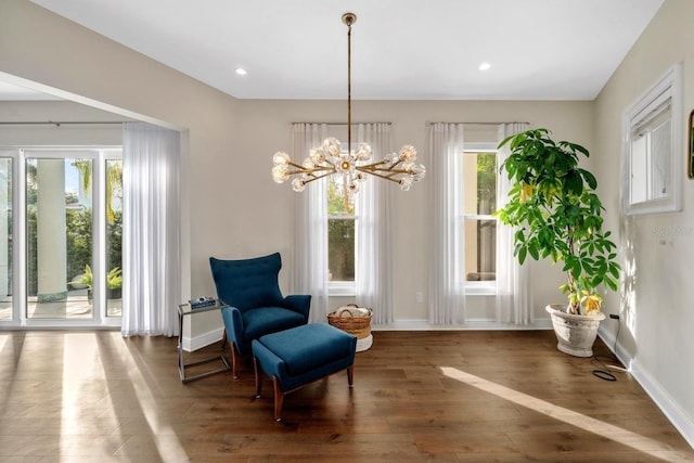 2711 W Trilby Ave, Tampa, FL 33611 - sitting room with wood finished floors, a chandelier, and recessed lighting