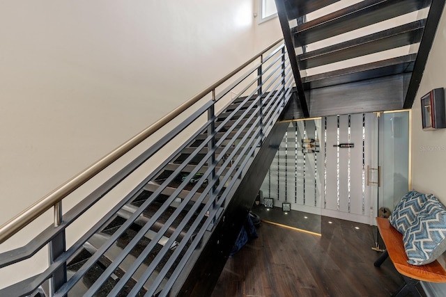 2711 W Trilby Ave, Tampa, FL 33611 - staircase with wood finished floors