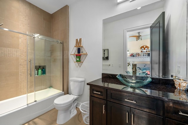 2711 W Trilby Ave, Tampa, FL 33611 - bathroom with vanity and combined bath / shower with glass door