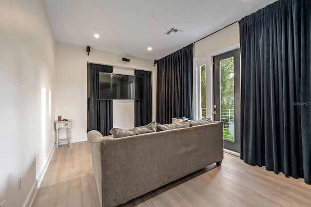 2711 W Trilby Ave, Tampa, FL 33611 - living room featuring light wood finished floors and recessed lighting