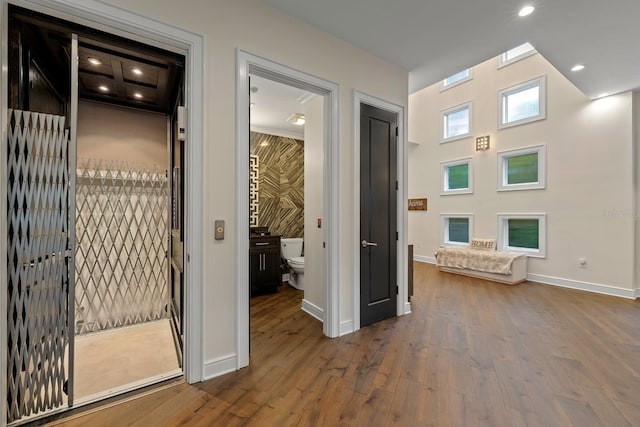 2711 W Trilby Ave, Tampa, FL 33611 - hallway with dark wood-style floors and recessed lighting