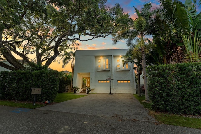 2711 W Trilby Ave, Tampa, FL 33611 - view of front of property with an attached garage and driveway
