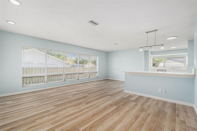 801 Lamont Pl, Temple Terrace, FL 33617 - unfurnished living room with wood finished floors and recessed lighting