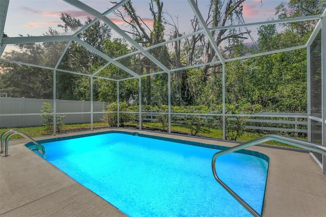 10032 Basin St, New Port Richey, FL 34655 - pool at dusk with glass enclosure
