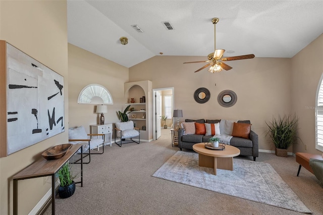 10032 Basin St, New Port Richey, FL 34655 - carpeted living area featuring healthy amount of natural light, ceiling fan, and vaulted ceiling