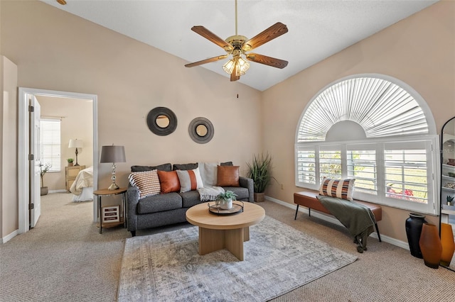 10032 Basin St, New Port Richey, FL 34655 - carpeted living room with ceiling fan and high vaulted ceiling