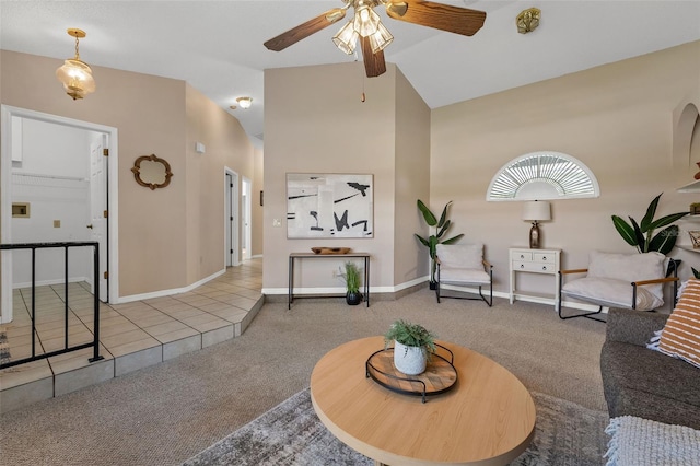 10032 Basin St, New Port Richey, FL 34655 - carpeted living area featuring ceiling fan, lofted ceiling, and tile patterned floors