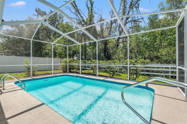 10032 Basin St, New Port Richey, FL 34655 - view of pool featuring glass enclosure and a patio area
