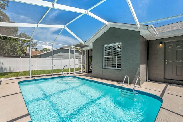 10032 Basin St, New Port Richey, FL 34655 - view of swimming pool with a patio area and glass enclosure
