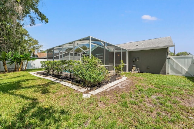 10032 Basin St, New Port Richey, FL 34655 - back of house with a fenced backyard and a lanai
