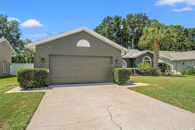 10032 Basin St, New Port Richey, FL 34655 - ranch-style home with stucco siding, a front lawn, concrete driveway, and an attached garage