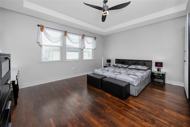 1601 Fox Grape Loop, Lutz, FL 33558 - bedroom with a tray ceiling, wood-type flooring, and a ceiling fan