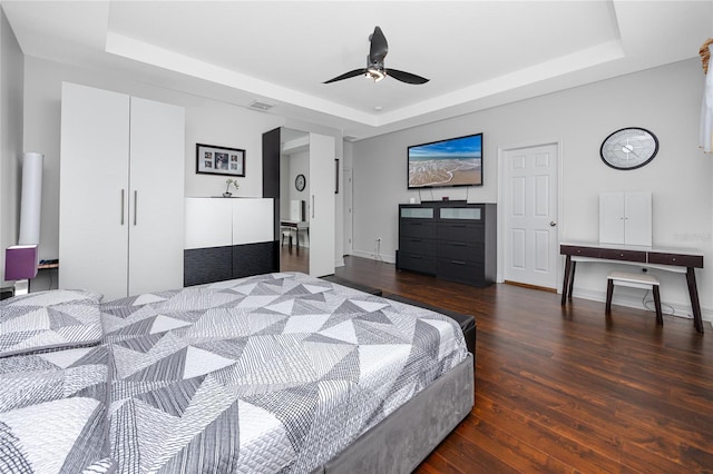 1601 Fox Grape Loop, Lutz, FL 33558 - bedroom with a raised ceiling, wood finished floors, and ceiling fan