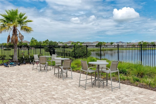 1601 Fox Grape Loop, Lutz, FL 33558 - view of patio featuring outdoor dining space and a water view