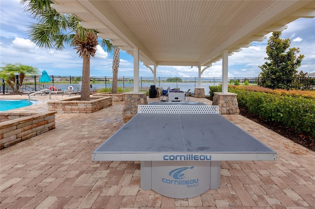 1601 Fox Grape Loop, Lutz, FL 33558 - fenced backyard featuring a patio and a water view