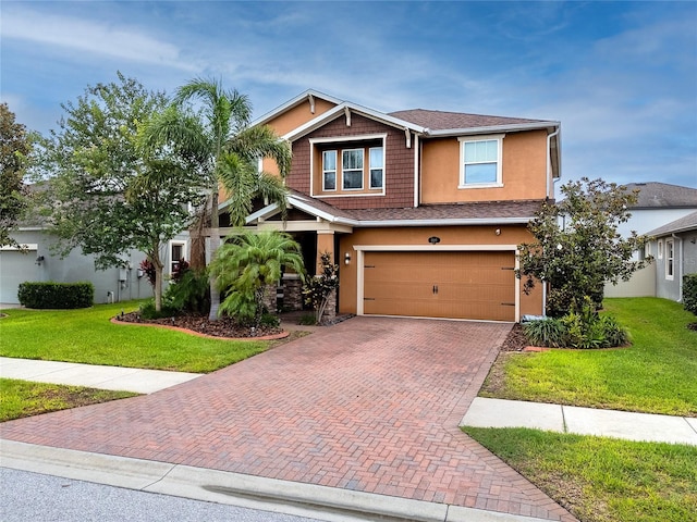 1601 Fox Grape Loop, Lutz, FL 33558 - craftsman inspired home featuring decorative driveway, a front lawn, a garage, and stucco siding