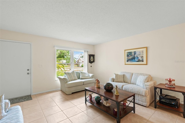 2875 Lomond Dr, Palm Harbor, FL 34684 - living room featuring light tile patterned floors and a textured ceiling