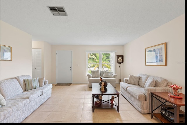 2875 Lomond Dr, Palm Harbor, FL 34684 - living area featuring light tile patterned floors and a textured ceiling