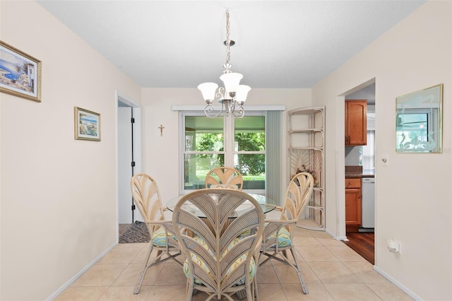 2875 Lomond Dr, Palm Harbor, FL 34684 - dining room featuring a chandelier and light tile patterned floors