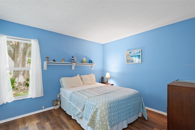 2875 Lomond Dr, Palm Harbor, FL 34684 - bedroom with wood finished floors and a textured ceiling