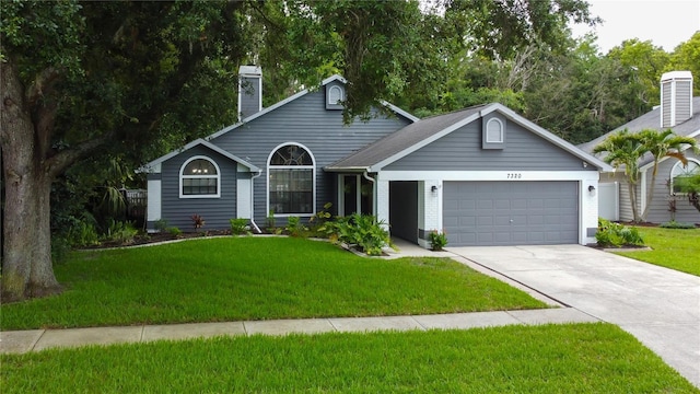 7320 Hideaway Trl, New Port Richey, FL 34655 - ranch-style house with a garage, driveway, a front yard, and a chimney