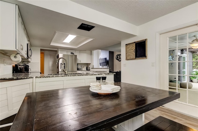 7320 Hideaway Trl, New Port Richey, FL 34655 - dining space featuring wood finished floors