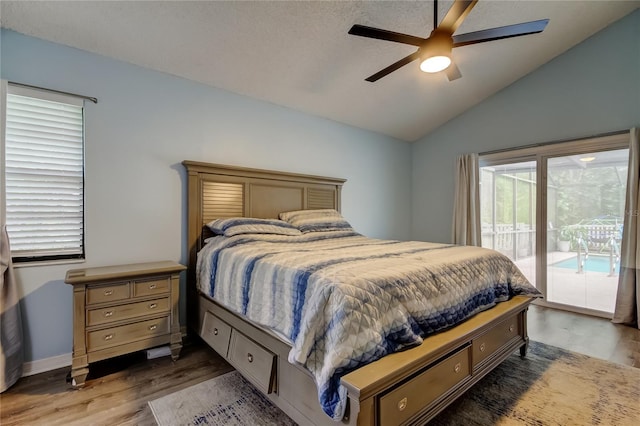 7320 Hideaway Trl, New Port Richey, FL 34655 - bedroom with access to outside, wood finished floors, vaulted ceiling, and a ceiling fan
