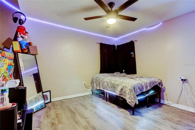 7320 Hideaway Trl, New Port Richey, FL 34655 - bedroom featuring wood finished floors and ceiling fan