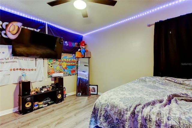 7320 Hideaway Trl, New Port Richey, FL 34655 - bedroom with wood finished floors and ceiling fan