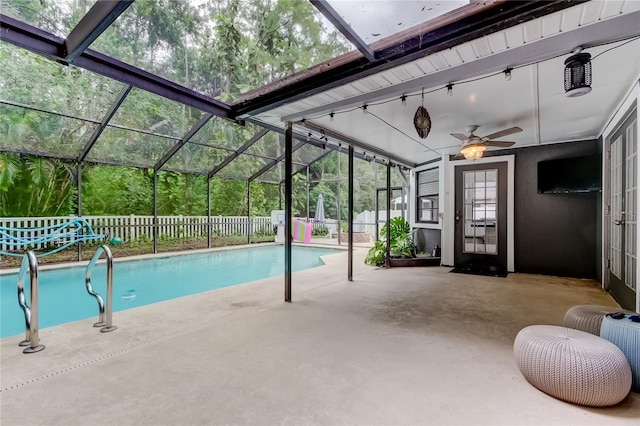 7320 Hideaway Trl, New Port Richey, FL 34655 - view of swimming pool with a patio, glass enclosure, a fenced backyard, and a ceiling fan