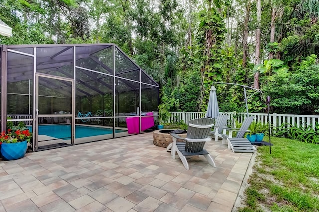 7320 Hideaway Trl, New Port Richey, FL 34655 - view of patio / terrace with an outdoor fire pit and a lanai