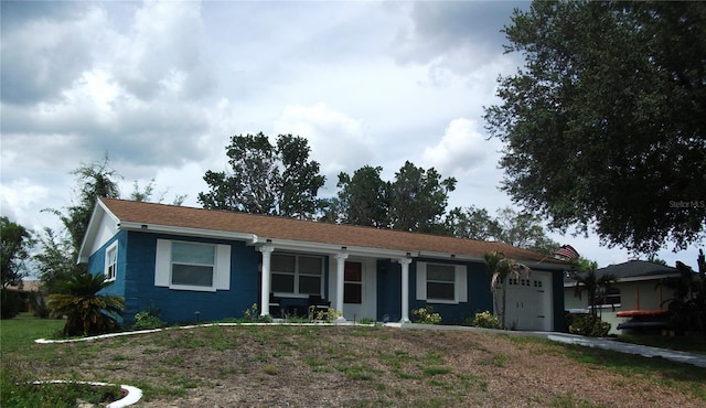 12411 Brookside St, Spring Hill, FL 34609 - ranch-style home with a garage and driveway