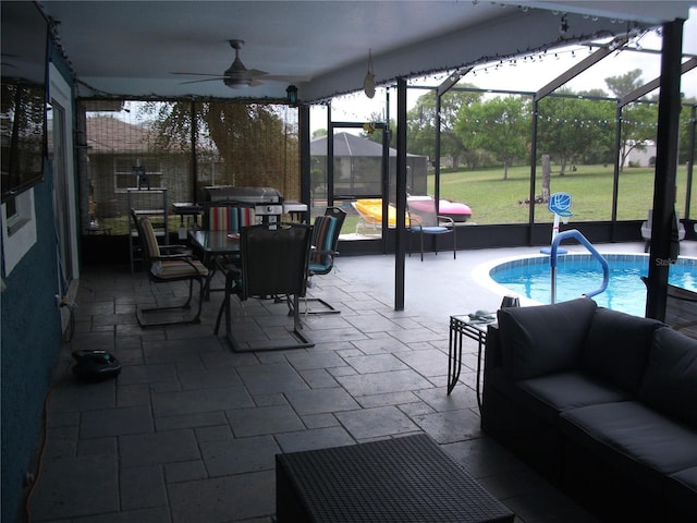 12411 Brookside St, Spring Hill, FL 34609 - view of patio / terrace featuring outdoor lounge area, an outdoor pool, a ceiling fan, glass enclosure, and outdoor dining area