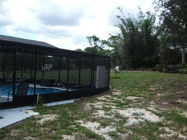 12411 Brookside St, Spring Hill, FL 34609 - view of yard featuring an outdoor pool and a lanai