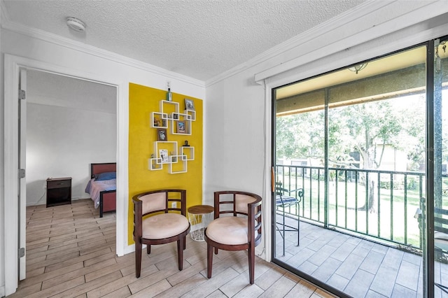 10195 Sailwinds Blvd N Unit 208, Largo, FL 33773 - living area with wood finished floors, a textured ceiling, and ornamental molding