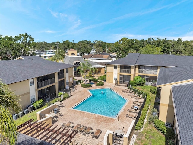 10195 Sailwinds Blvd N Unit 208, Largo, FL 33773 - community pool featuring a patio and a residential view