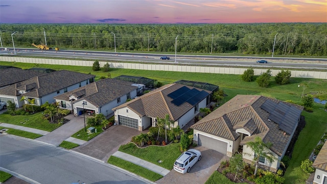 20828 Cattail Blvd, Venice, FL 34292 - aerial view at dusk of a forest view and a residential view