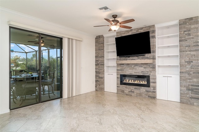 20828 Cattail Blvd, Venice, FL 34292 - unfurnished living room featuring ceiling fan, built in features, a large fireplace, ornamental molding, and a sunroom
