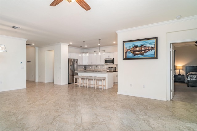 20828 Cattail Blvd, Venice, FL 34292 - living room featuring a ceiling fan, crown molding, and recessed lighting