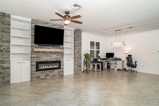 20828 Cattail Blvd, Venice, FL 34292 - living area with an office area, built in shelves, ceiling fan, a fireplace, and crown molding
