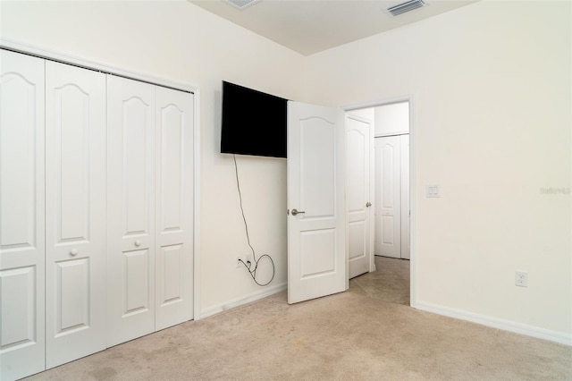 20828 Cattail Blvd, Venice, FL 34292 - unfurnished bedroom with light carpet and a closet