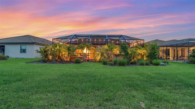 20828 Cattail Blvd, Venice, FL 34292 - view of green lawn with glass enclosure