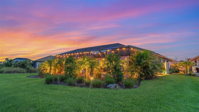 20828 Cattail Blvd, Venice, FL 34292 - view of side of home with a lawn and a lanai