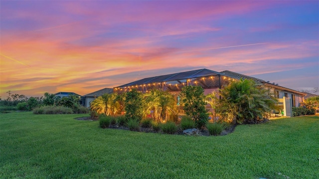 20828 Cattail Blvd, Venice, FL 34292 - property exterior at dusk with a lawn