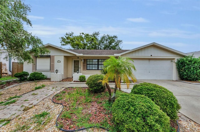 4143 Gray Squirrel Ln, New Port Richey, FL 34653 - ranch-style home with brick siding, a garage, and driveway